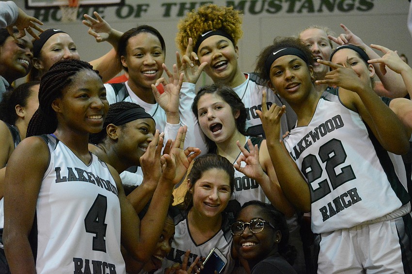 The Mustangs make silly faces in the wake of a win.