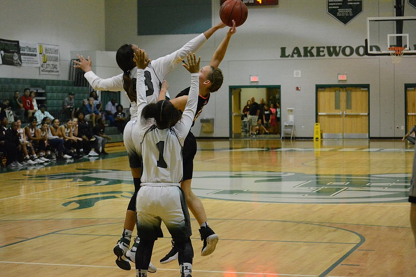 Senior LaDazhia Williams blocks a Sarasota shot.