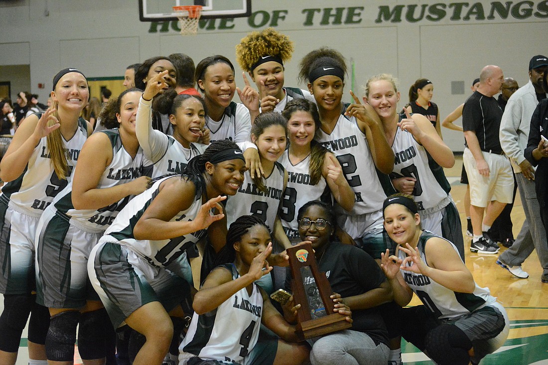The Lakewood Ranch girls team poses with the title.