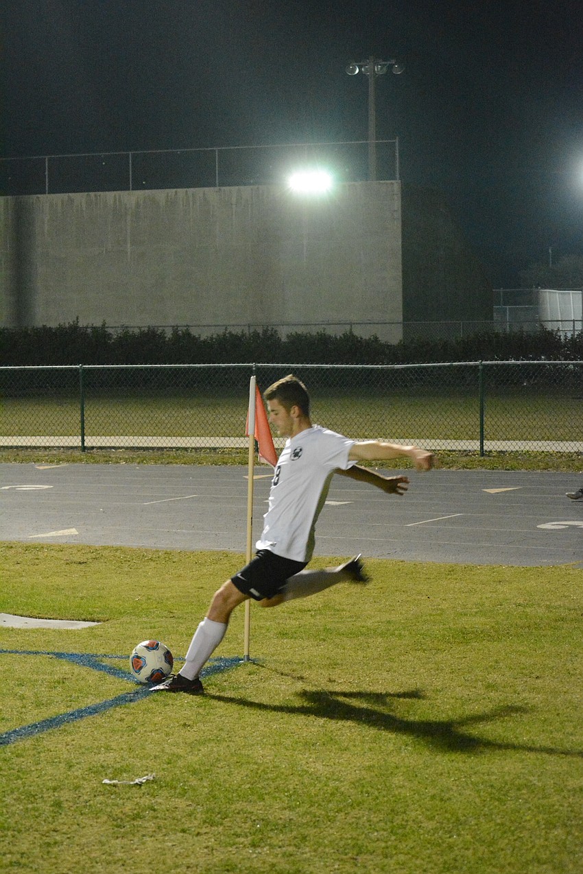 Sam Stapleton-Jones takes a corner kick.