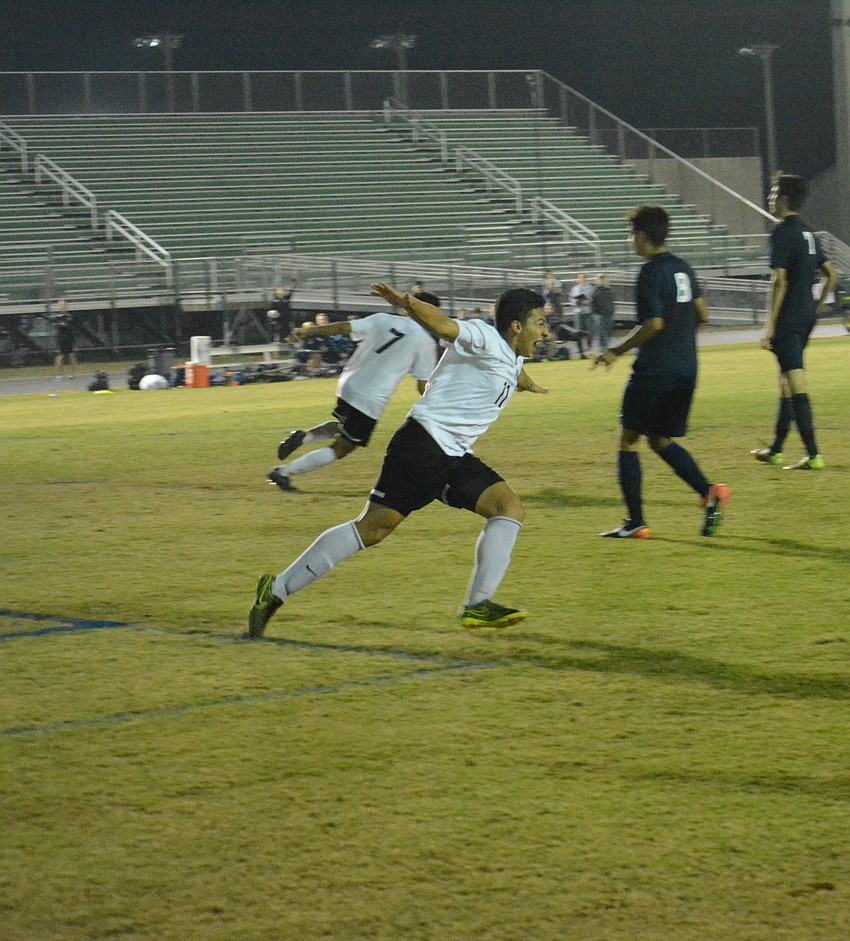 Pablo Vargas airplanes in celebration after a goal.