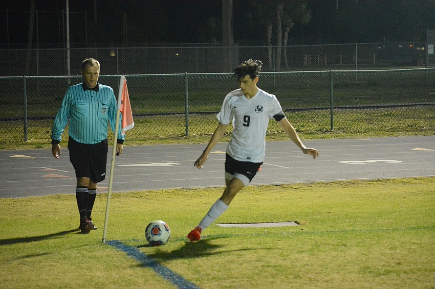 Connor Bezet takes a corner kick.