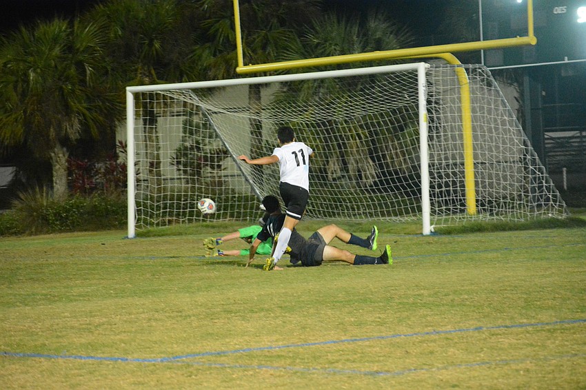 Pablo Vargas puts a shot past the Palm Harbor goalkeeper.