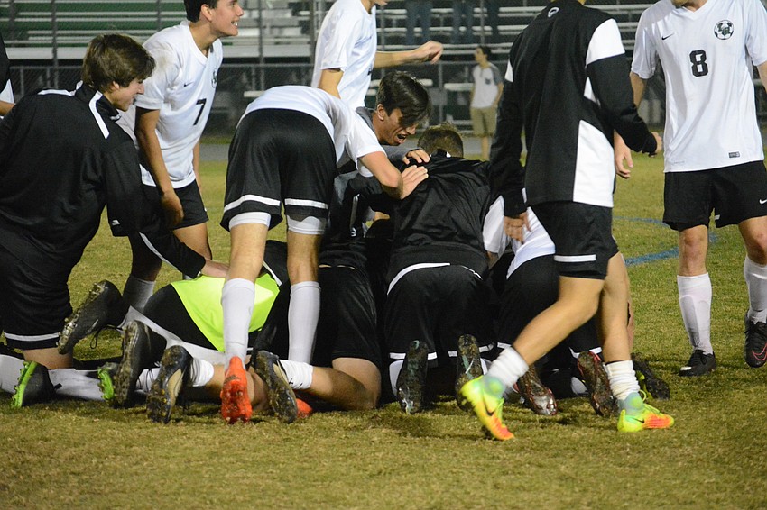The Mustangs celebrate after the big win.