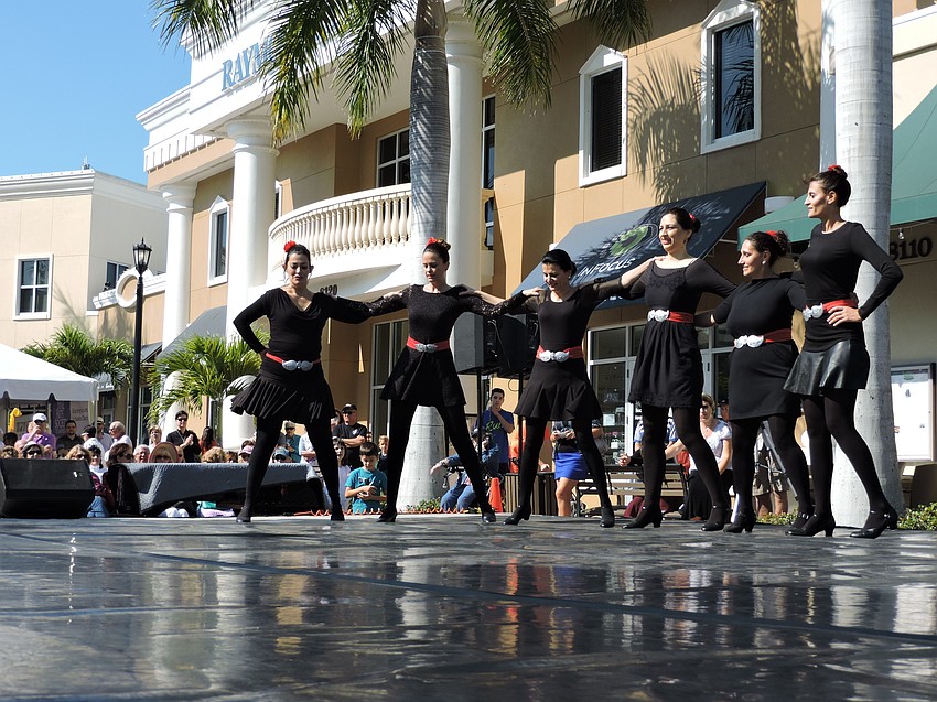 A traditional Greek dance is demonstrated for the crowd.