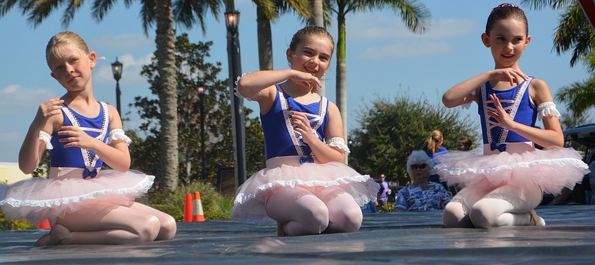Liesl Cockrell, 7; Audrey DeLuca, 9; and Elizabeth Shaw, 9, perform during 