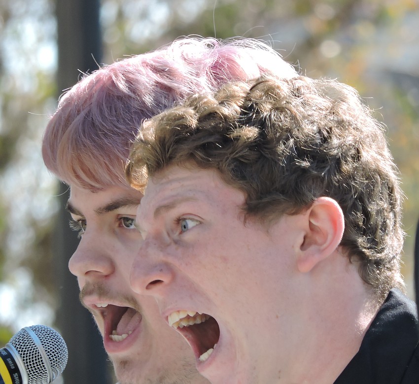 Senior Jackson Helwege and sophomore Fermin Llosa  belt out 