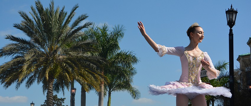 Sarah Shaw, 15, blends into the streetscape on Lakewood Main Street.