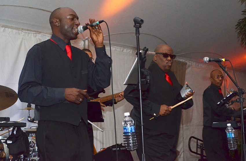 Members of Pocket Change perform.