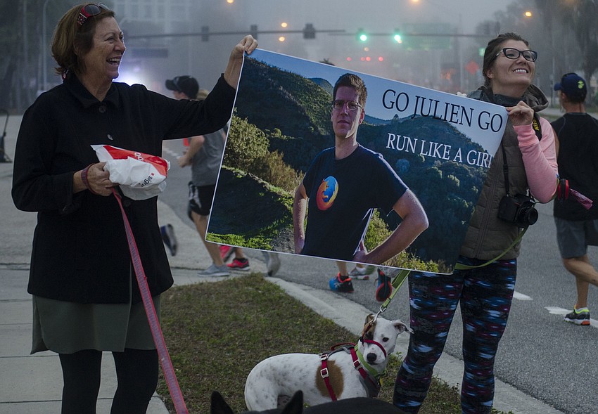 SueAnn Levin holds a sign with Bibi  Vehent.
