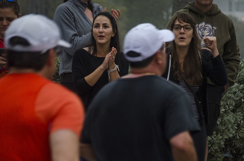 Soraya Preseault and Becca Chamberlain cheer on runners of the Sarasota Music Half Marathon