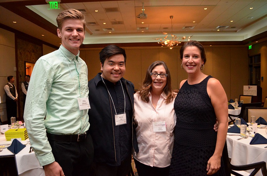Ringling College of Art and Design students Philip Gleichauf and Robson Tan, computer animation faculty member Karen Sullivan and Special Assistant to the President Jamie Coffey