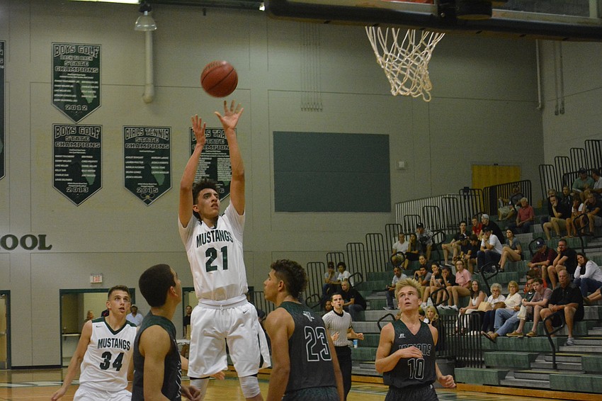 Junior Evan Spiller takes a mid-range jump shot.