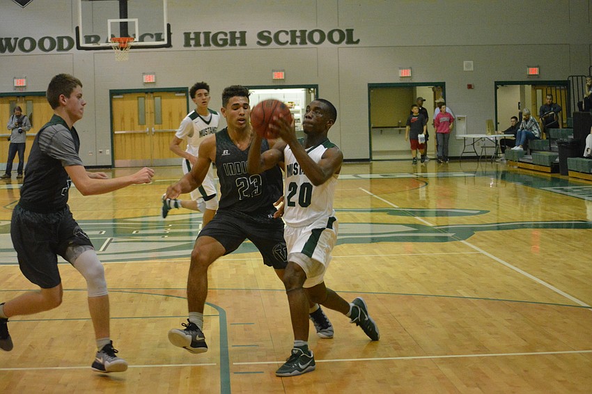 Senior Devin Twenty drives to the basket.