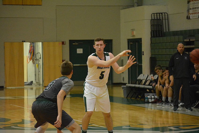 Senior Sam Hester delivers a no-look pass.