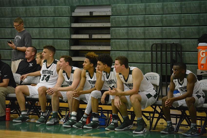 Jack Kelley, Sam Hester, Damien Gordon, Evan Spiller, Justin Muscara and Devin Twenty watch their teammates from the bench.
