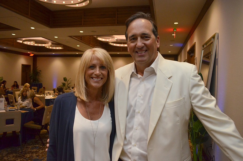 Auctioneer Adam Armbruster with his wife, event organizer Suzanne Armbruster