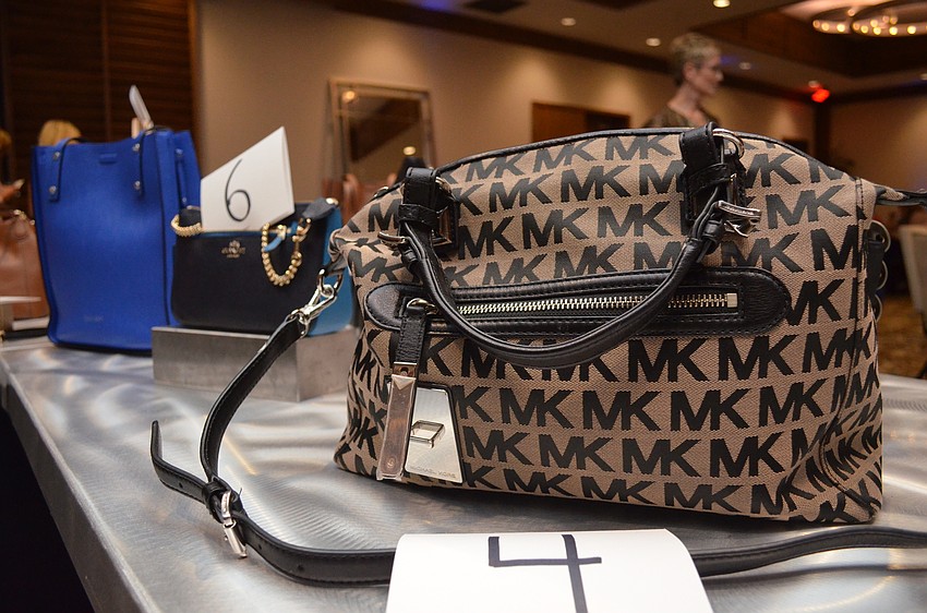 Several Michael Kors bags were included in the 16 purses given out as prizes to Bingo winners.