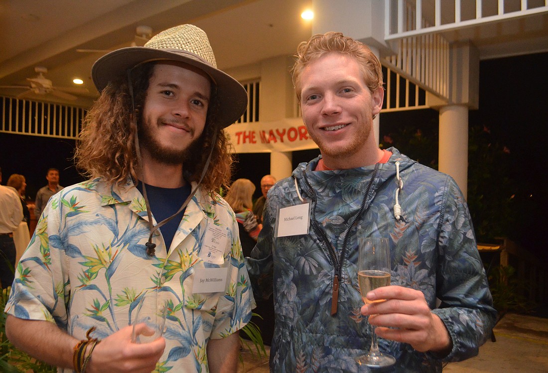 Jay McWilliams and Michael Long are previous scholarship recipients and  were models in this year&#39;     s Taste of the Keys and Fashion Show. File photo.