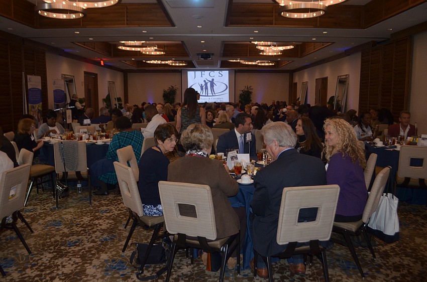 About 140 people enjoy a meal at The Francis in Sarasota during the 