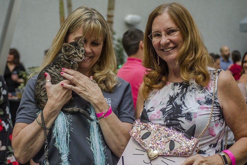 Deb Harrington and Sherry Zenor pose with Damien.