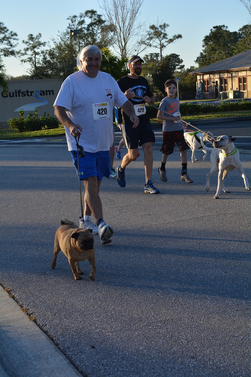 Vic Perri, visiting from Pennsylvania, walked with his dog, Toot.
