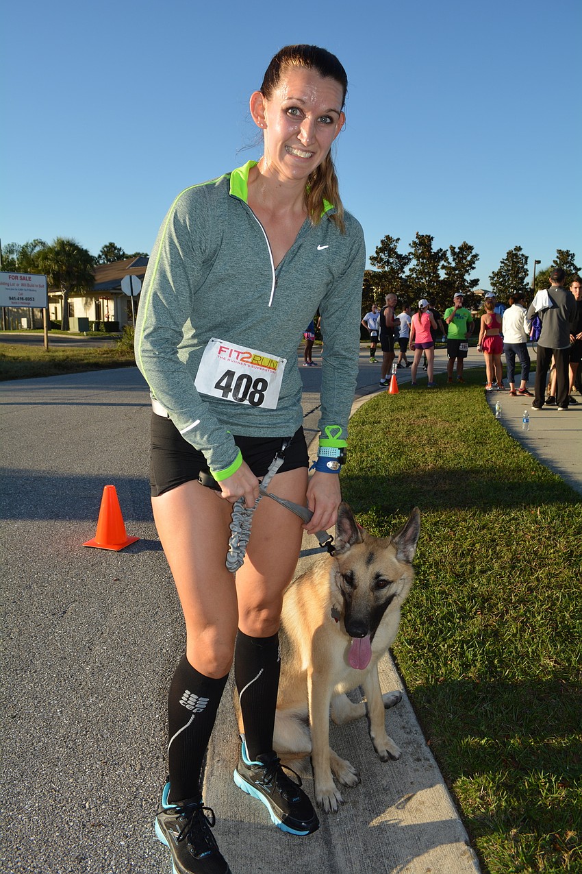Megan Guarenta, of Englewood, runs every day with Abby, but hasn'  t gotten to do many 5Ks with her.