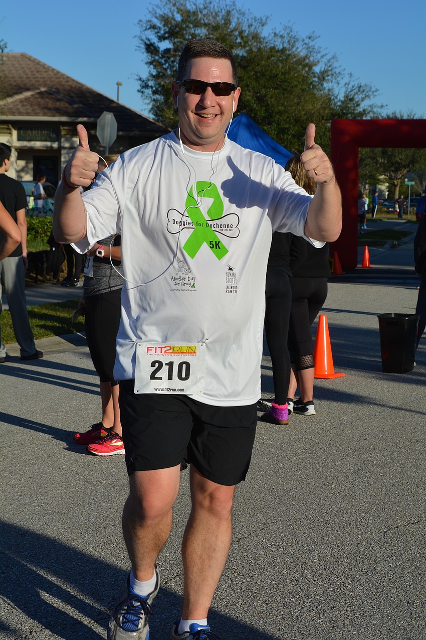 Greenbrook resident Nick Tullio finishes the race with a thumbs up, before saying 