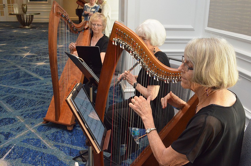 Harpists perform for guests before the start of the Tidewell Hospice Signature Luncheon at The Ritz-Carlton, Sarasota on Feb. 10.