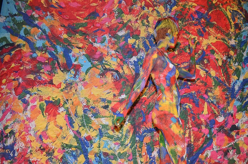 Models covered in paint blended in with three colorful paintings, moving ever so slightly every couple minutes to show guests that they were there.