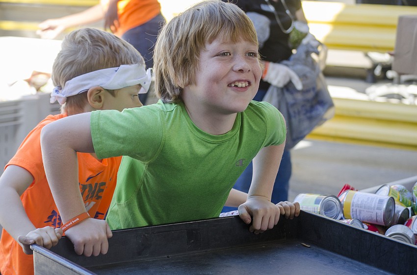 Ezra Weinstein takes a ride on one of the sorting carts.