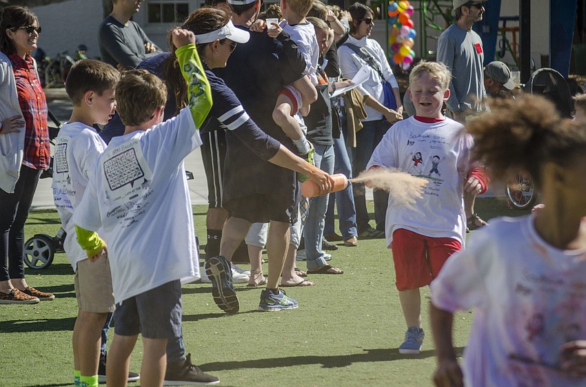 Students ran through clouds of colored chalk at the Southside Jog-a-thon Color Run.