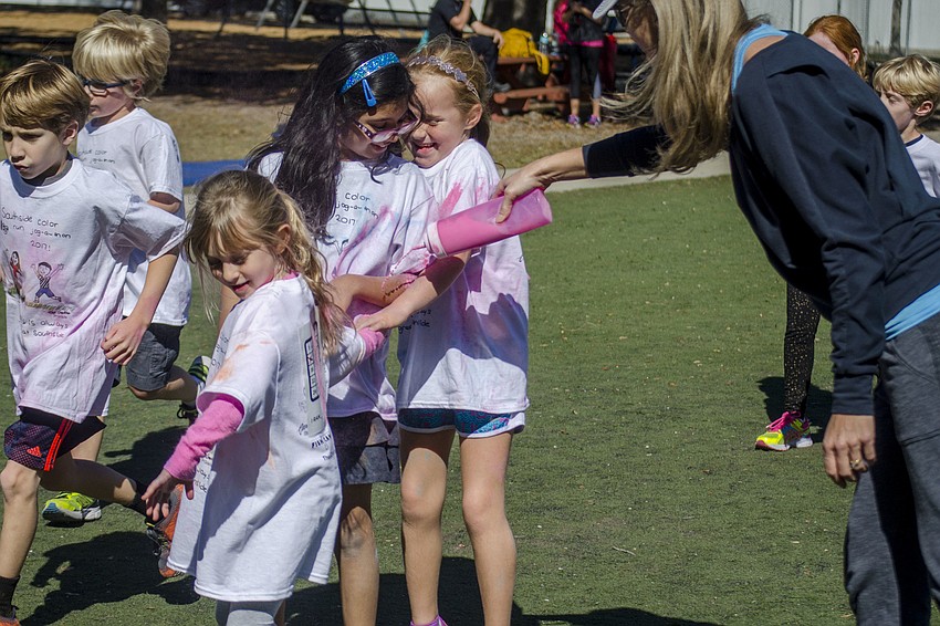 Students ran through clouds of colored chalk at the Southside Jog-a-thon Color Run.