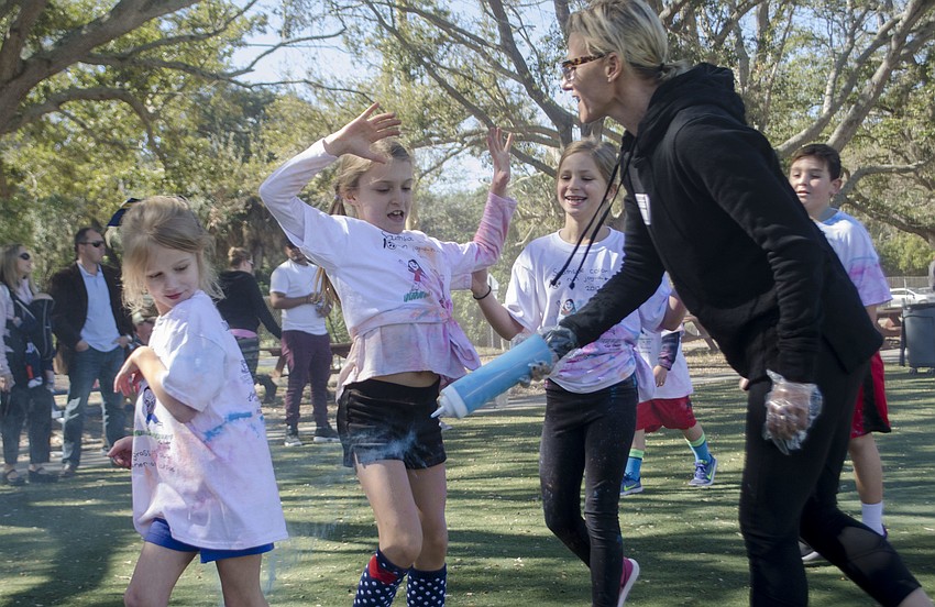 Students ran through clouds of colored chalk at the Southside Jog-a-thon Color Run.