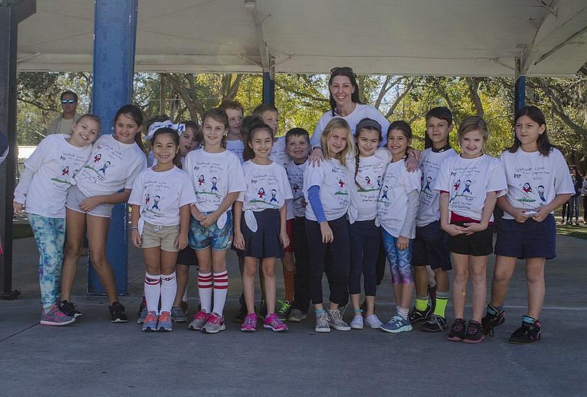 Kirsten Hazelton'   s poses before participating in the jog-a-thon.
