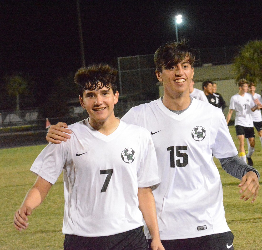 Seniors Ricky Yanez and Chance Cohen celebrate together.