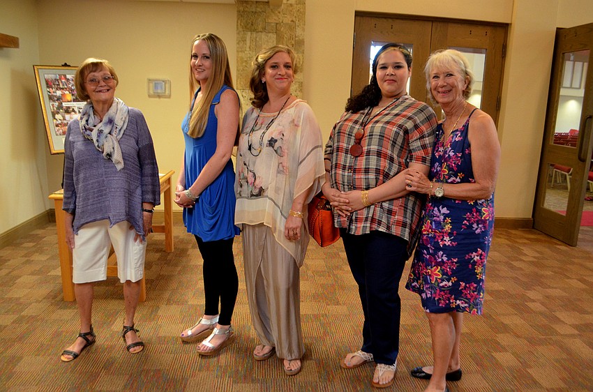 Women of Learn to Fish Recovery Center strike their best pose before the fashion show with Willeen Buchholz of Mary Kay, who did all the make up for the event.