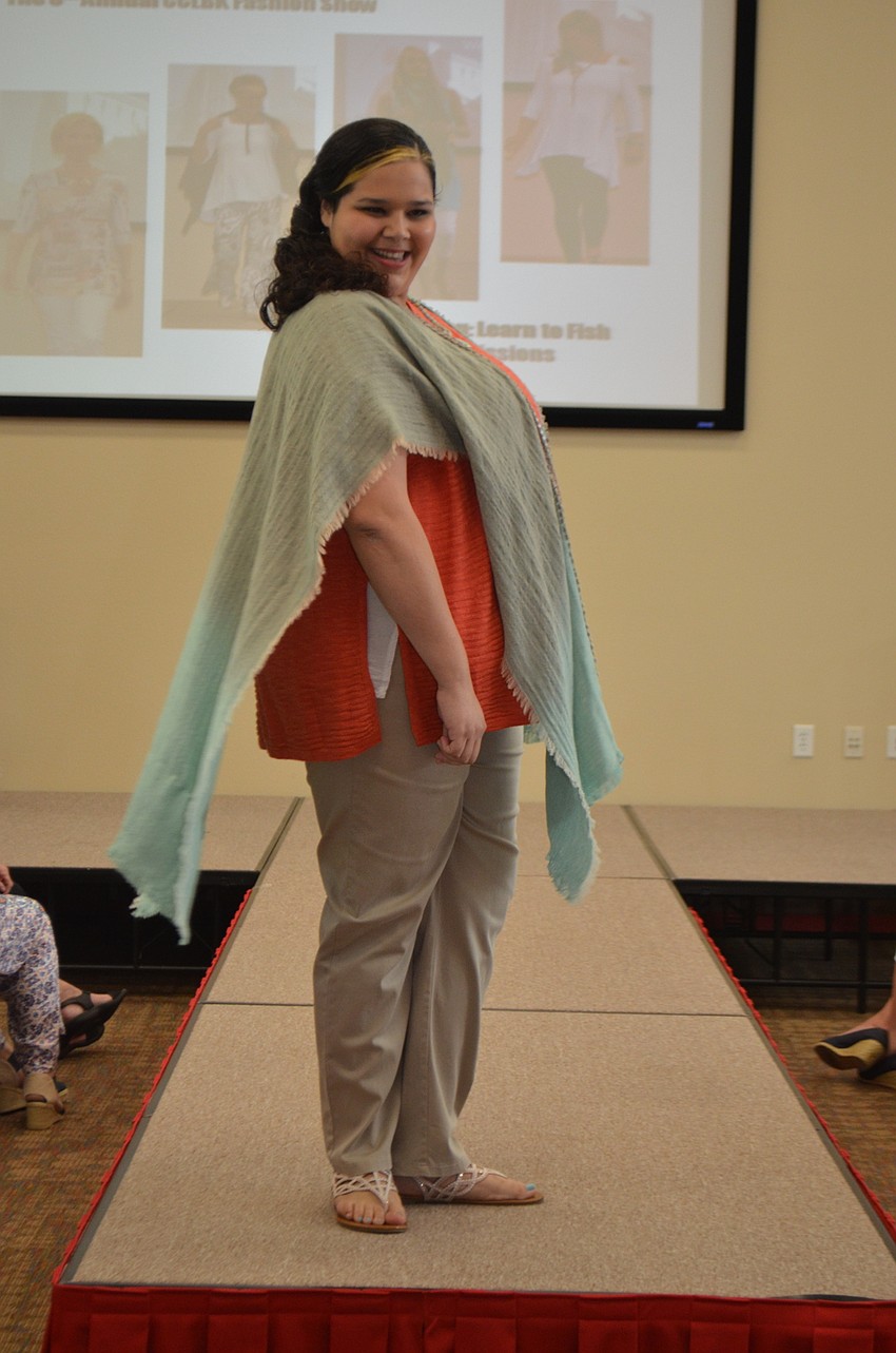 Lindsey smiles as she takes a turn on the runway during the Christ Church fashion show.