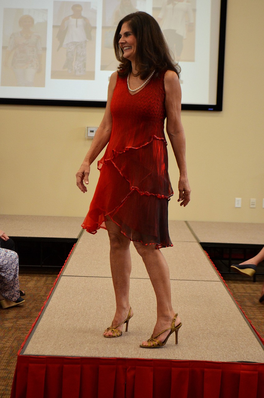 Mary Lou Johnson smiles as she models during Christ Church’s annual fashion show on Feb. 13.
