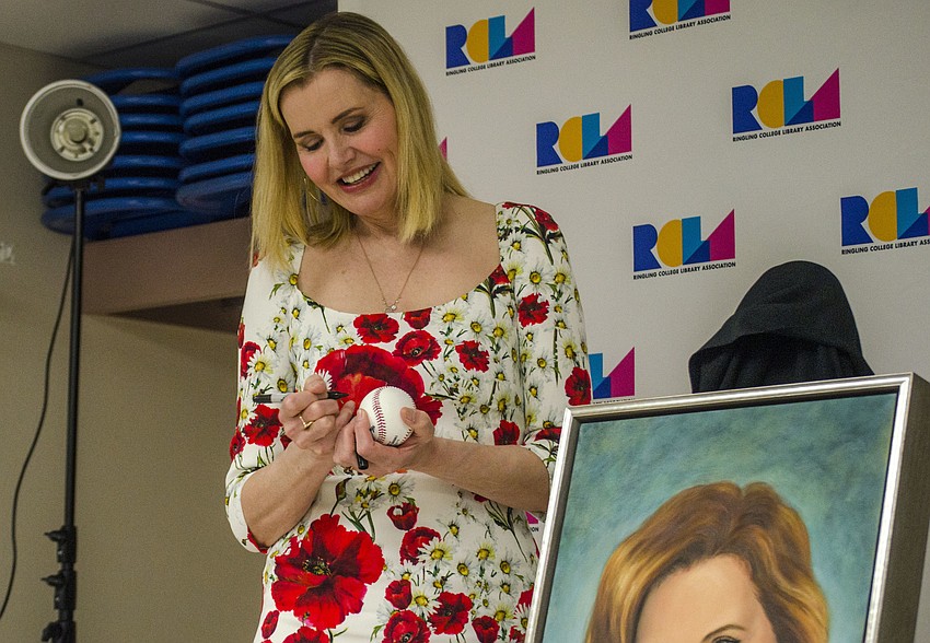 Geena Davis signs a baseball for Ringling College of Art and Design student Elizabeth Gray.
