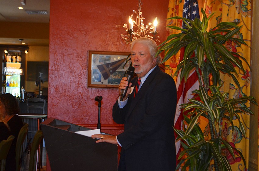 Incoming club President Ken Marsh speaks to the group.