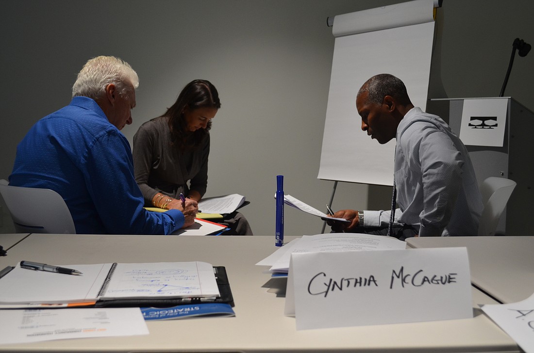 Sarasota Bayfront Planning Organization members A.G. Lafley, Jennifer Compton and Keith Dubose brainstorm at a January meeting.
