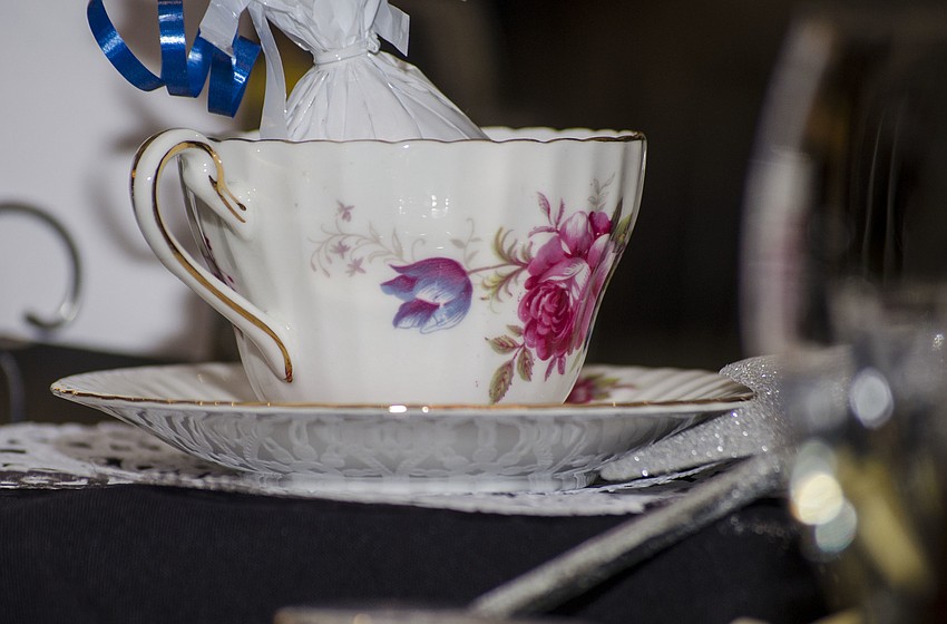 A tea cup was placed in the center of each table.