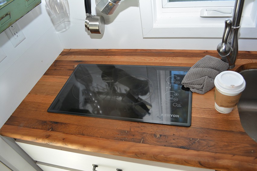 Stephanie Arne said one of her few complaints about the Tiny House is that the two burners on the electric stove are very close together.