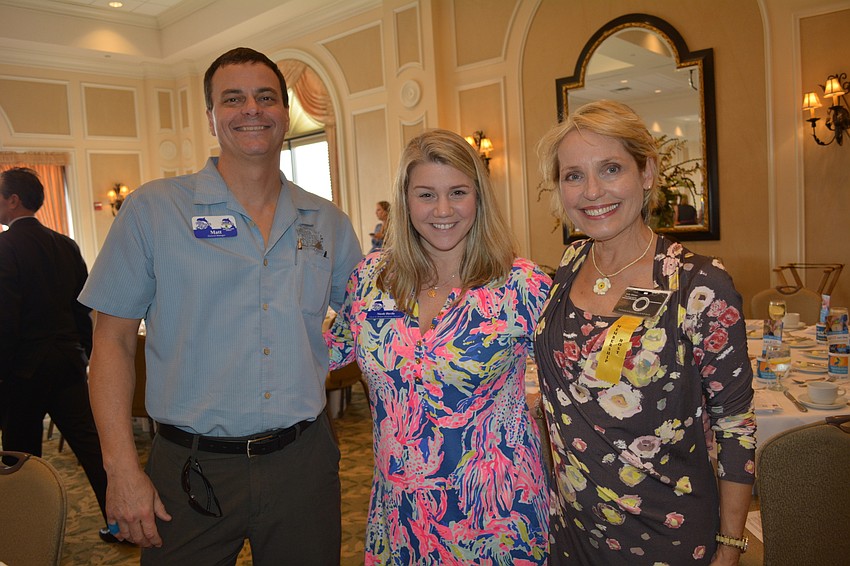matt Andrus and Nicole Davila, both of Anna Maria Oyster Bar, with Sally Ullman, of Sally Ullman Photography