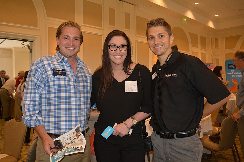 Rotarian Christopher Johnson with Melissa DeAngelo, of West Florida Insurance Agency, and Kenny Slezak, of Willis Smith Construction