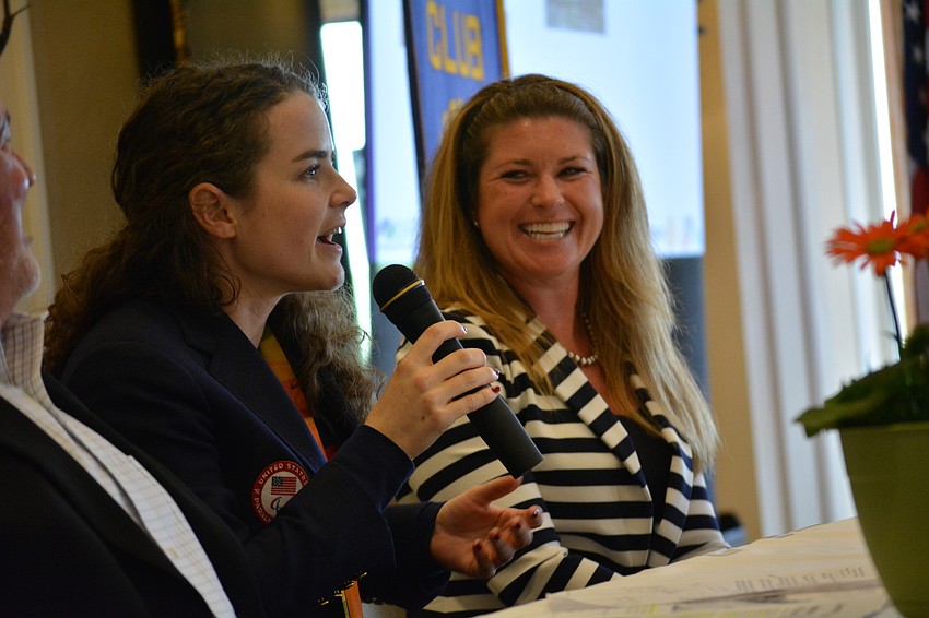 U.S. Women'    s Team coxswain Jenny Sichel tells the crowd how excited athletes are to compete in their home country, as US World Rowing Championship Executive Director Meredith Scerba watches.