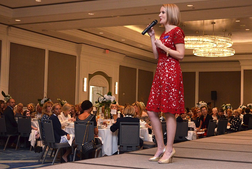 SPARCC President and CEO Jessica Hays encourages attendees to donate to the organization.