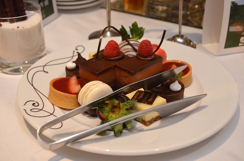 Guests enjoyed a dessert tray that consisted of macarons, chocolate cake bites, chocolate-covered strawberries and several tarts.
