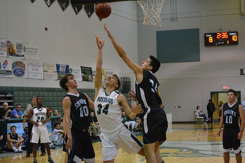 Jack Kelley throws up a reverse layup,